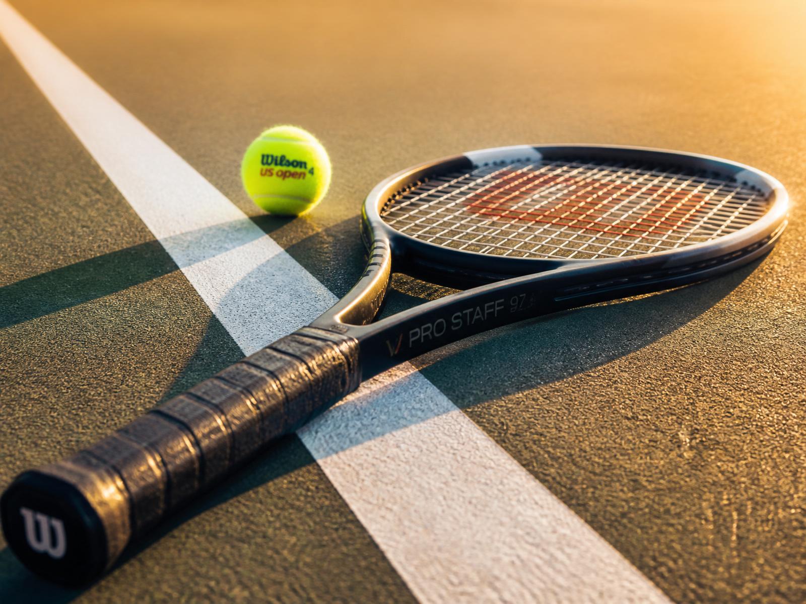 Tennis racket on clay court